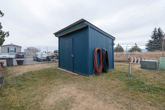 view of outbuilding with a yard