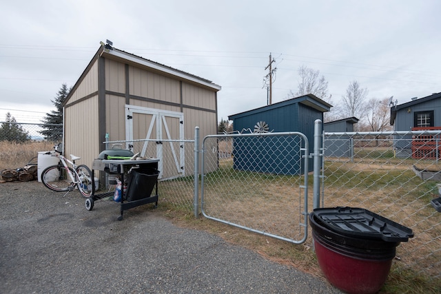 view of outbuilding featuring a lawn