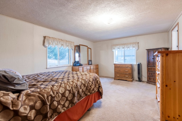 carpeted bedroom with a textured ceiling