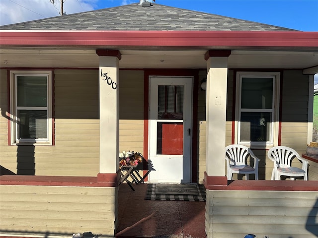 property entrance featuring a porch