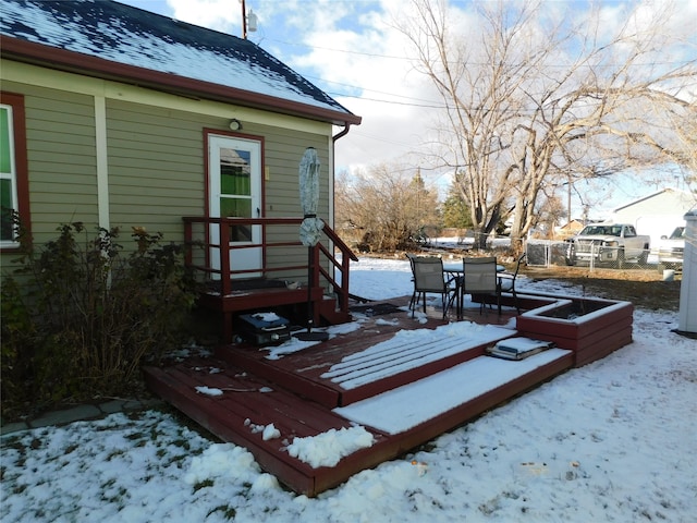 view of snow covered deck