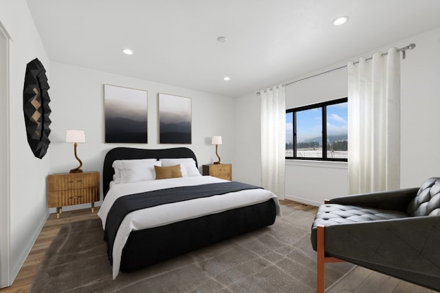 bedroom with hardwood / wood-style flooring