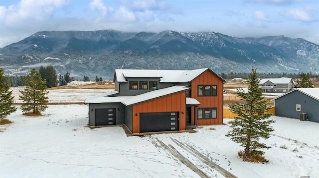 view of front of house featuring a mountain view and a garage