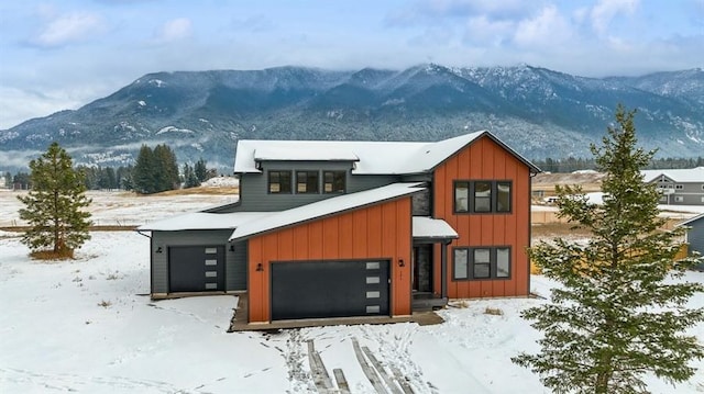 view of front of house featuring a mountain view and a garage