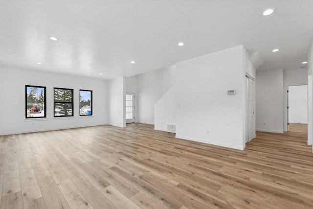 unfurnished living room with light hardwood / wood-style floors