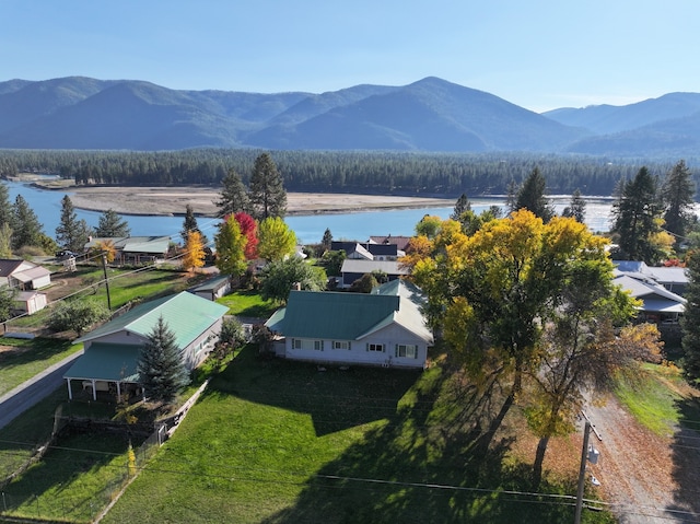 birds eye view of property featuring a water and mountain view