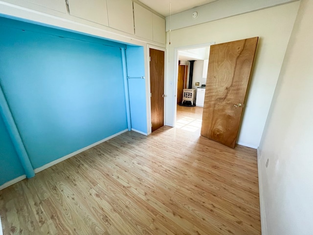 spare room featuring light hardwood / wood-style floors