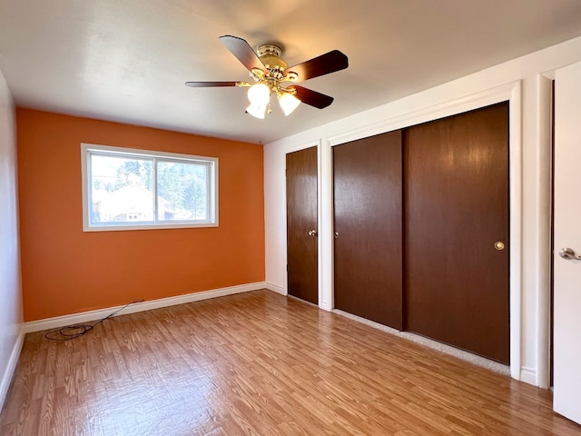 unfurnished bedroom featuring ceiling fan and light hardwood / wood-style floors