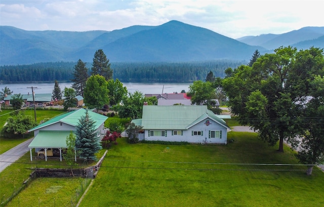 birds eye view of property featuring a water and mountain view