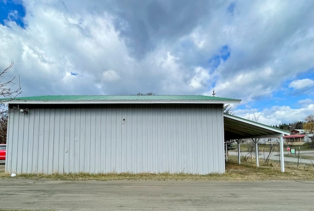 view of outbuilding with a carport