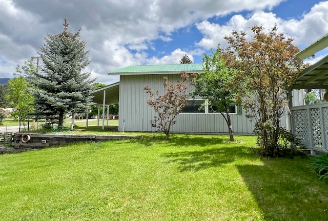 view of yard with a carport