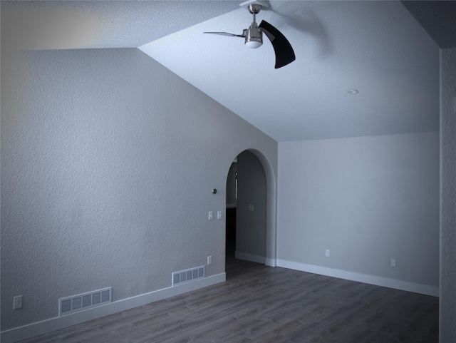 4019 Lancaster Rd, Missoula, MT 59808 - empty room with lofted ceiling, a ceiling fan, arched walkways, and wood finished floors