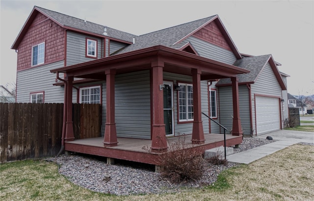 4019 Lancaster Rd, Missoula, MT 59808 - view of side of home featuring roof with shingles, an attached garage, a porch, and driveway