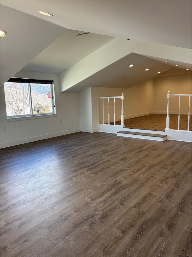 4019 Lancaster Rd, Missoula, MT 59808 - additional living space with lofted ceiling, dark wood finished floors, and recessed lighting