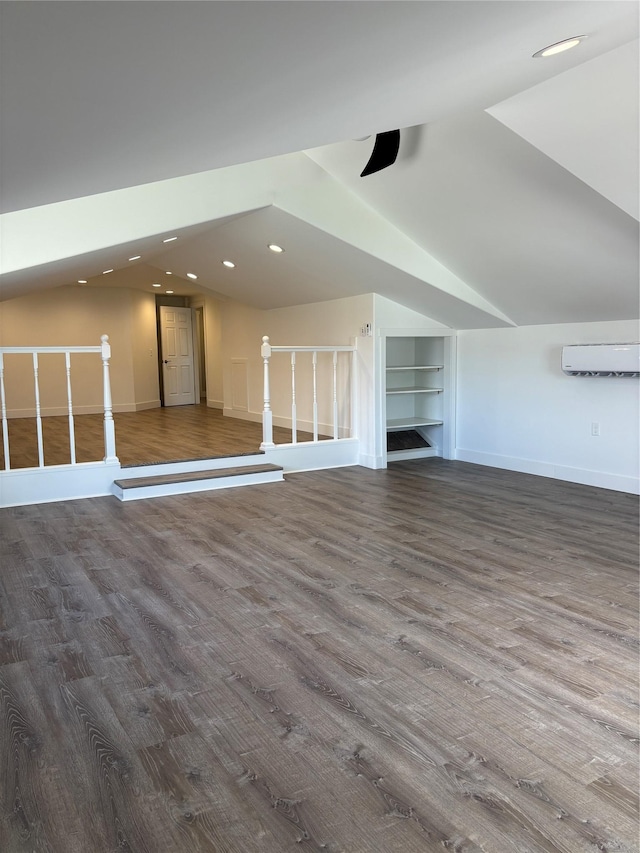 4019 Lancaster Rd, Missoula, MT 59808 - additional living space with vaulted ceiling, wood finished floors, an AC wall unit, recessed lighting, and a ceiling fan
