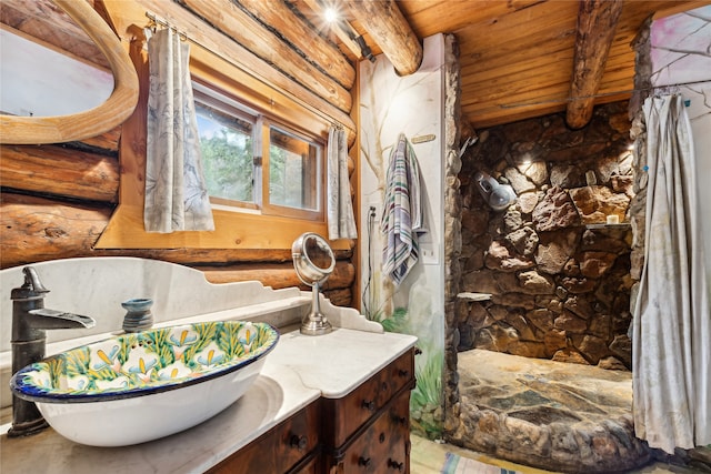 bathroom with beam ceiling, vanity, and wooden ceiling