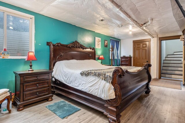 bedroom with light wood-type flooring