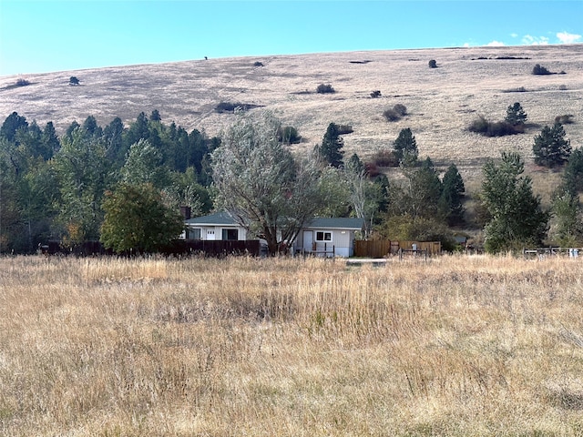 mountain view featuring a rural view