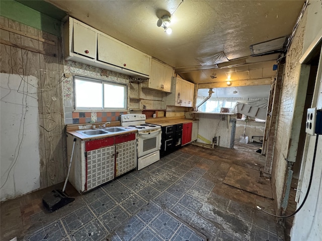 kitchen with white electric range oven and sink