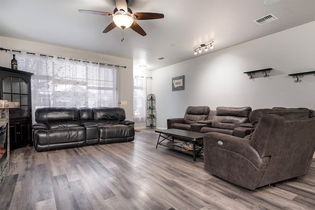 126 Moes Run, Kalispell, MT 59901 - living room featuring a ceiling fan, visible vents, and wood finished floors