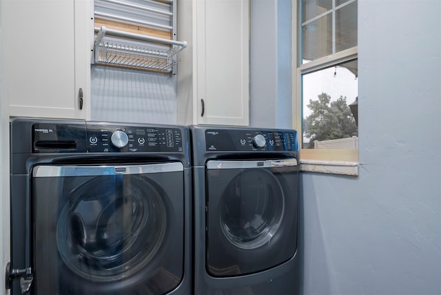 126 Moes Run, Kalispell, MT 59901 - clothes washing area featuring cabinet space and washer and dryer
