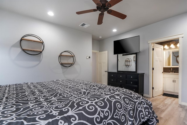 126 Moes Run, Kalispell, MT 59901 - bedroom featuring a sink, recessed lighting, wood finished floors, and visible vents