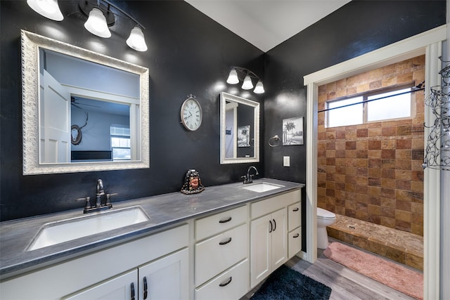 126 Moes Run, Kalispell, MT 59901 - bathroom featuring a sink, a tile shower, and a wealth of natural light