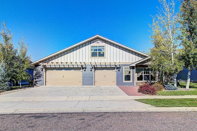 126 Moes Run, Kalispell, MT 59901 - craftsman-style house featuring a garage, board and batten siding, and driveway