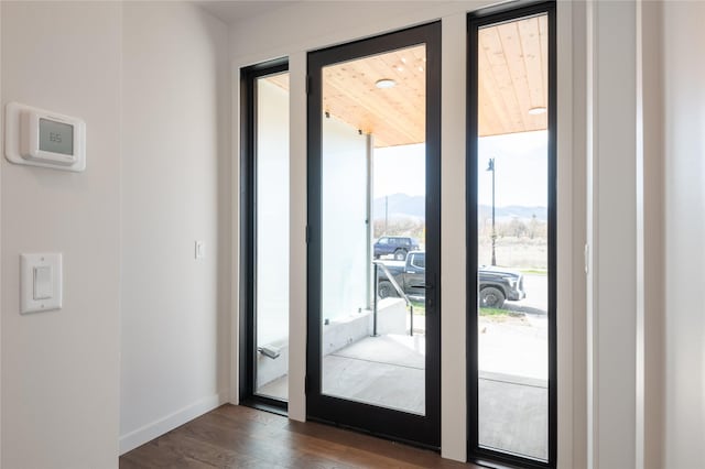 entryway with dark wood-type flooring