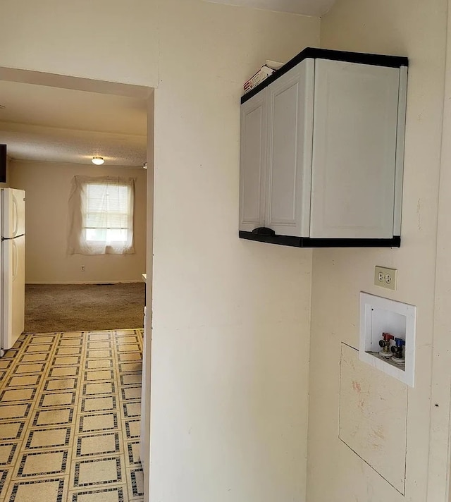 laundry area featuring carpet flooring, cabinets, and hookup for a washing machine