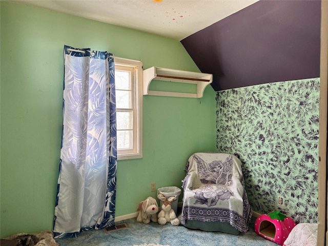 unfurnished bedroom with carpet and lofted ceiling