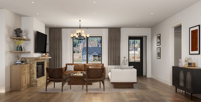 living room with hardwood / wood-style flooring and a notable chandelier