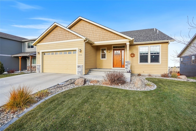 craftsman-style house with a front yard and a garage