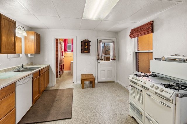 kitchen featuring a paneled ceiling, dishwasher, and sink