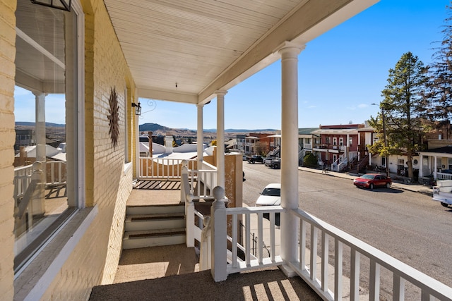 exterior space with a mountain view and a porch