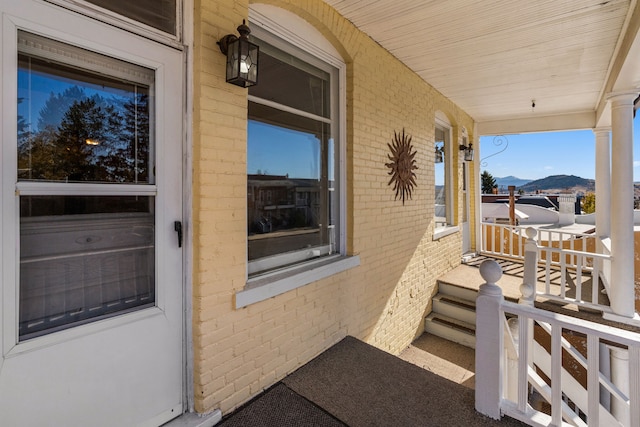 exterior space featuring a mountain view and a porch