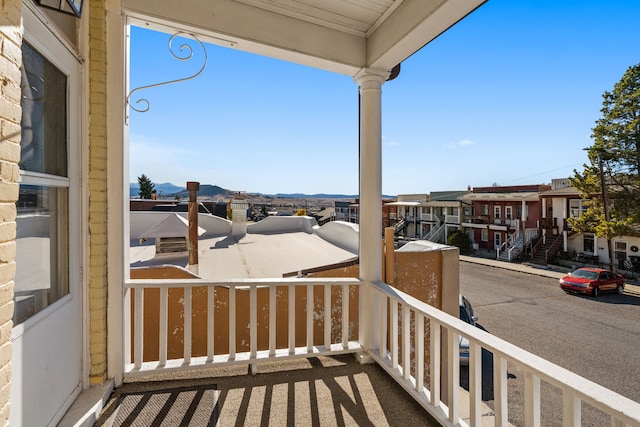 balcony featuring a porch