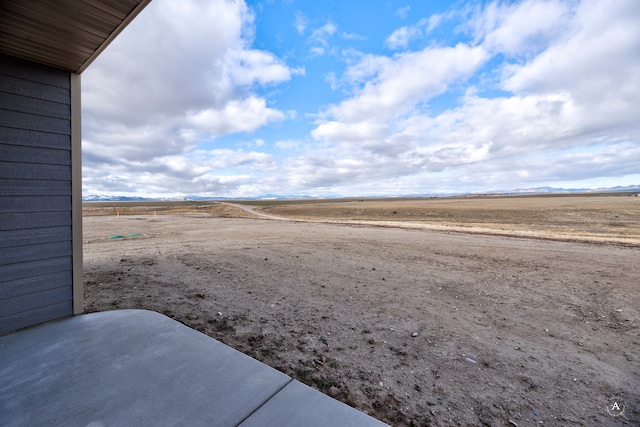 view of yard with a rural view