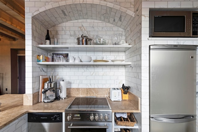 kitchen with backsplash and stainless steel appliances