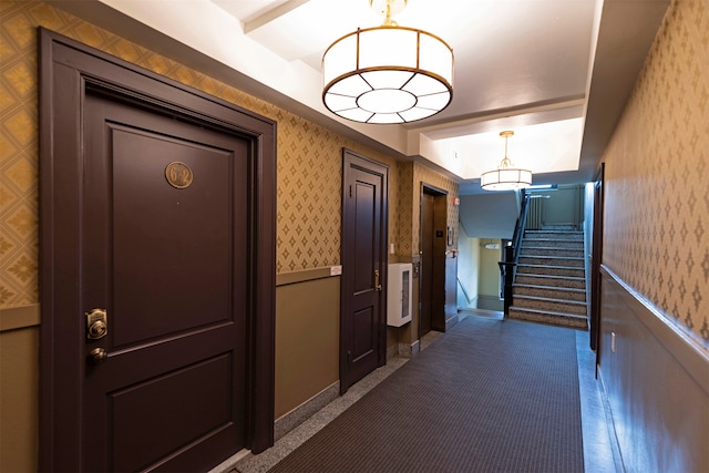 hallway featuring a notable chandelier