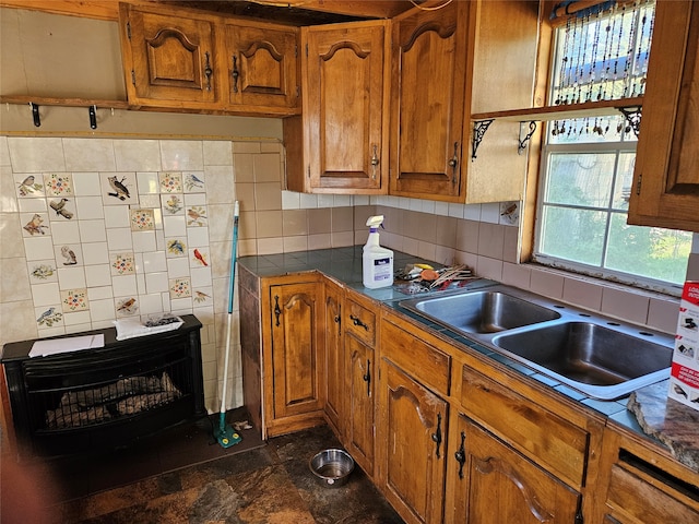 kitchen featuring decorative backsplash and sink