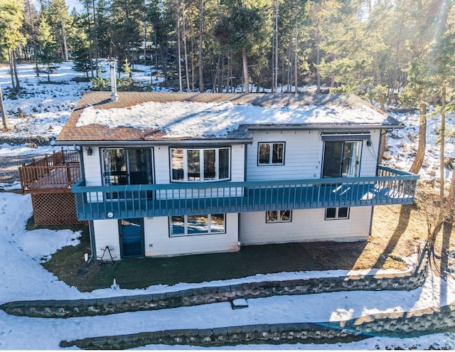 view of front of property with a wooden deck