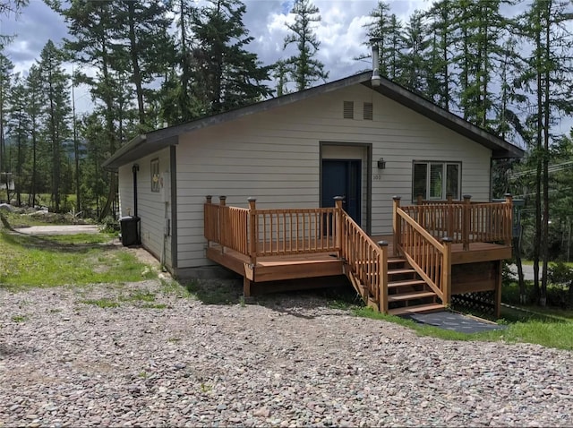 back of property featuring a wooden deck