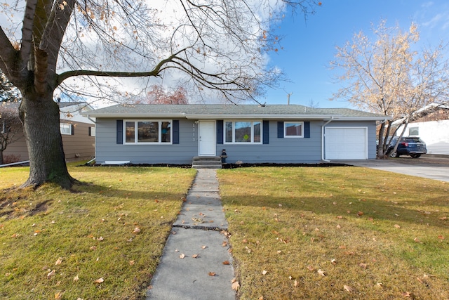 single story home with a garage and a front yard