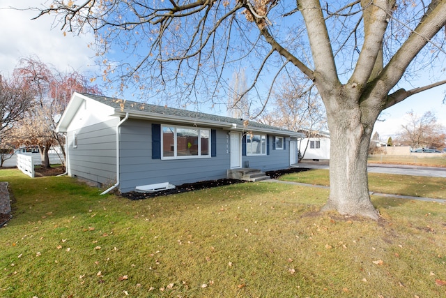 ranch-style house with a front lawn