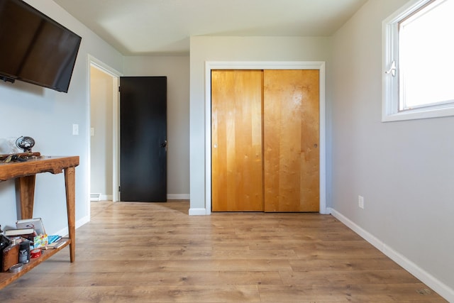 bathroom featuring hardwood / wood-style floors, vanity, toilet, and plenty of natural light