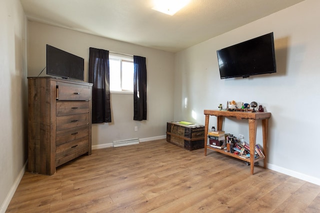 bedroom with light hardwood / wood-style floors