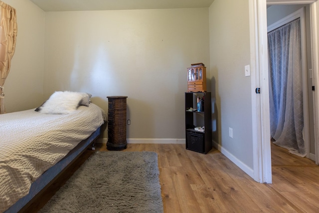 bedroom with light wood-type flooring