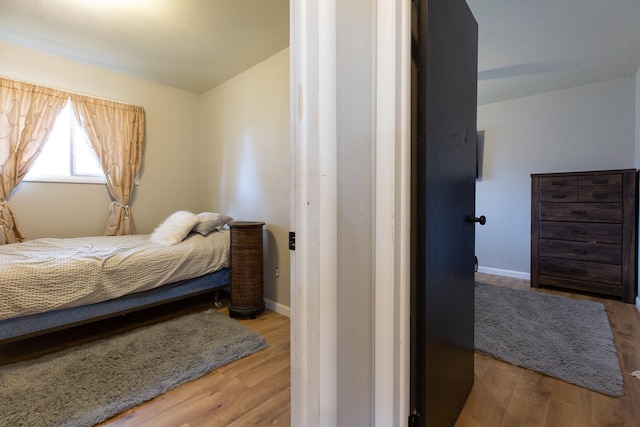 bedroom with light hardwood / wood-style flooring