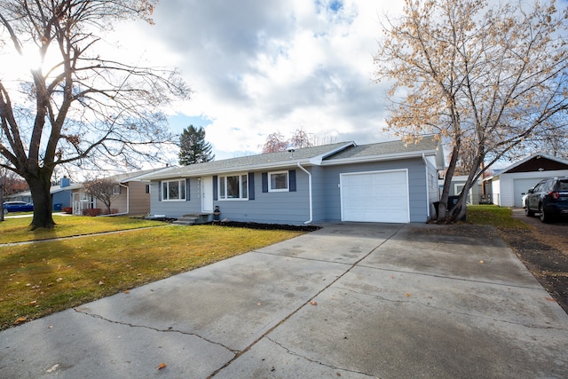 ranch-style house with a garage and a front lawn